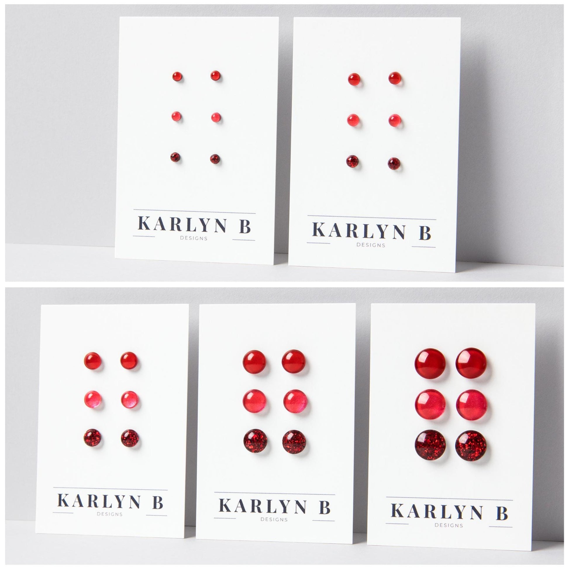 Five sets of stud earrings on white cards with the text "KARLYN B DESIGNS". Each set features three pairs of earrings in different shades of cherry red.