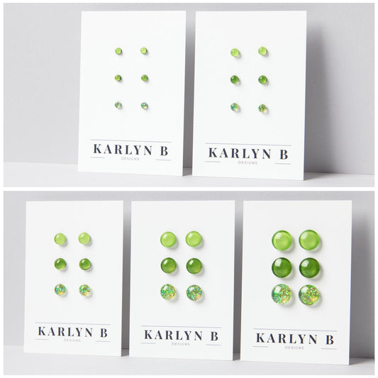 Five sets of stud earrings on white cards with the text "KARLYN B DESIGNS". Each set features three pairs of earrings in different shades of bright green.
