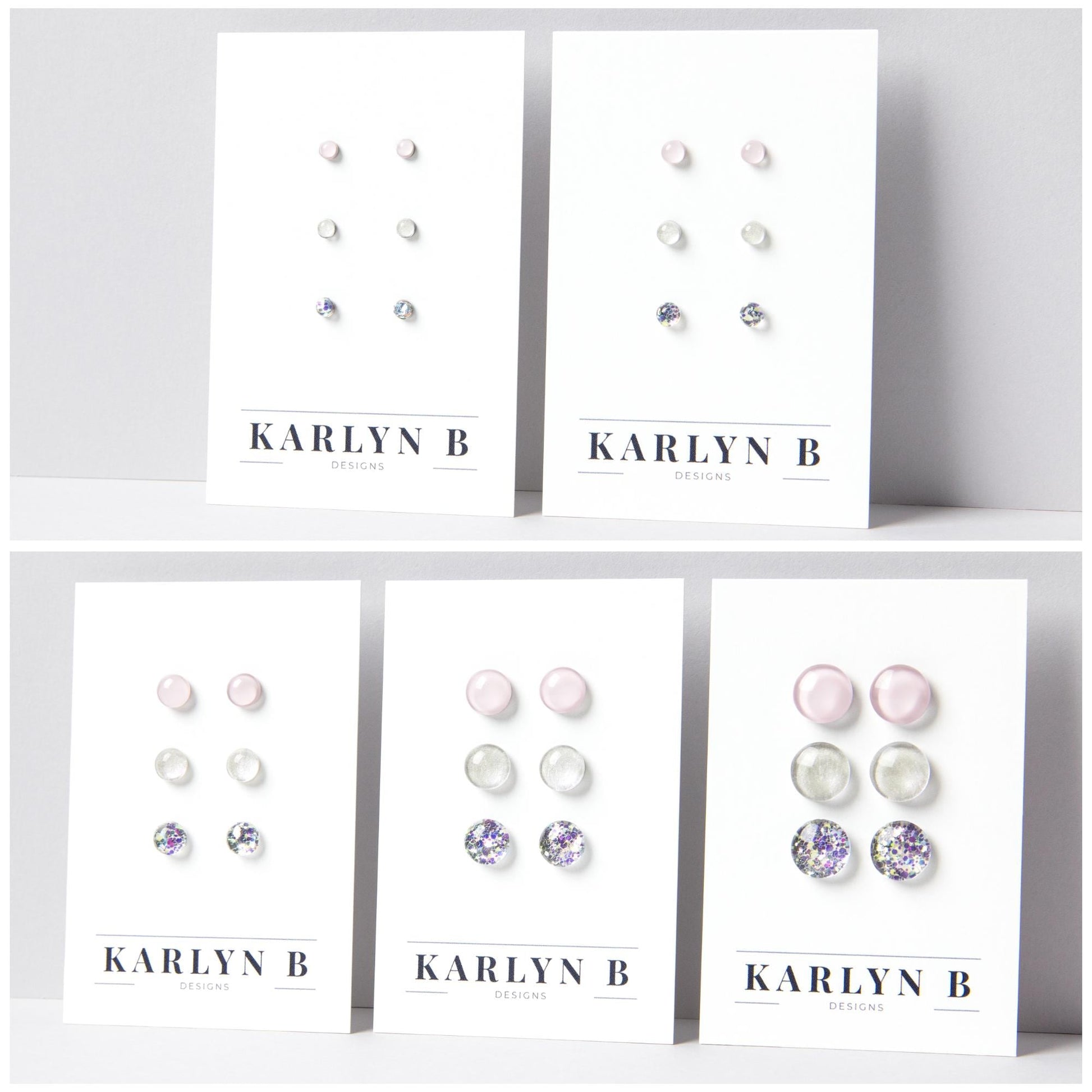 Five sets of stud earrings on white cards with the text "KARLYN B DESIGNS". Each set features three pairs of earrings in different shades of light pink, opal white and opal silver glitter.
