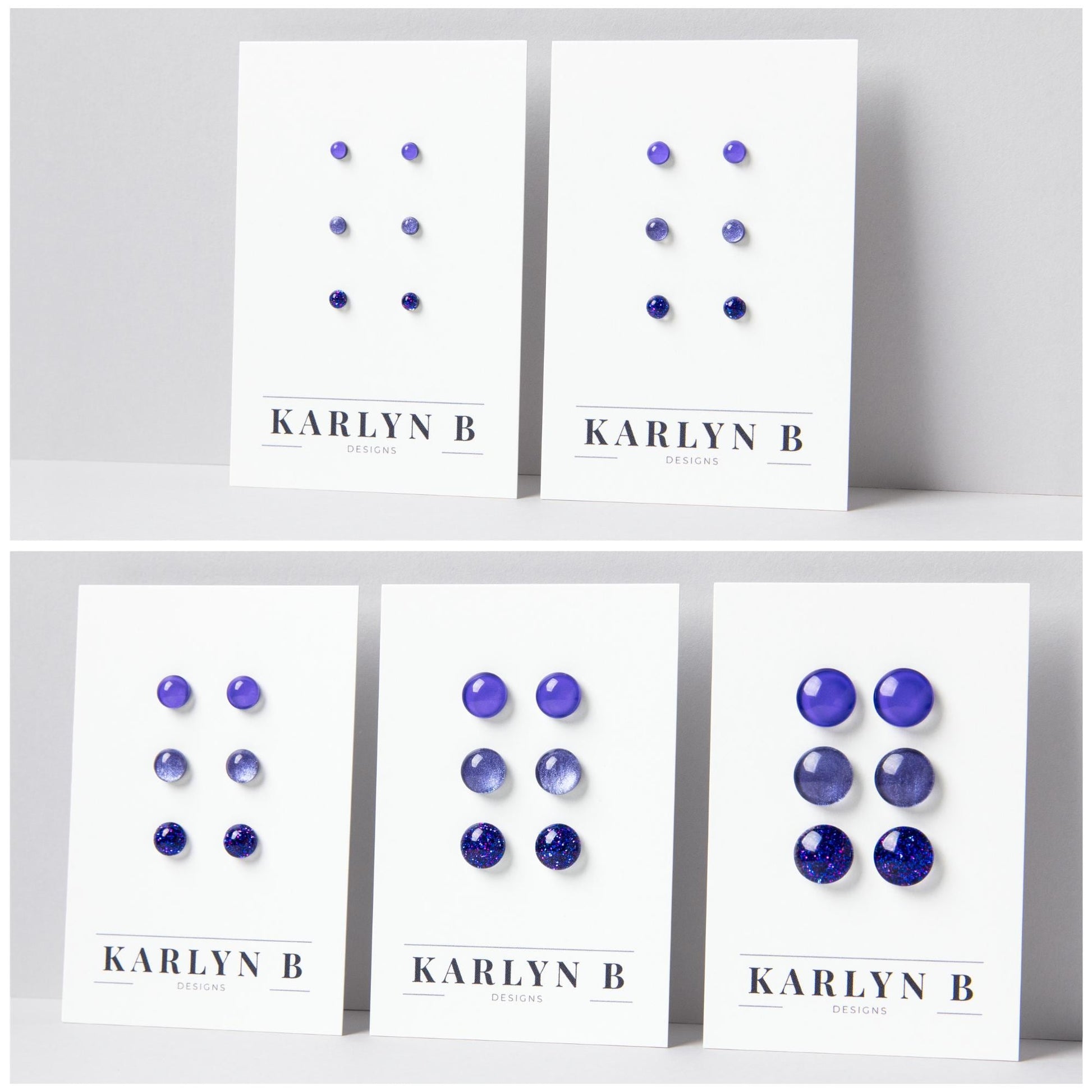 Five sets of stud earrings on white cards with the text "KARLYN B DESIGNS". Each set features three pairs of earrings in different shades of purple.